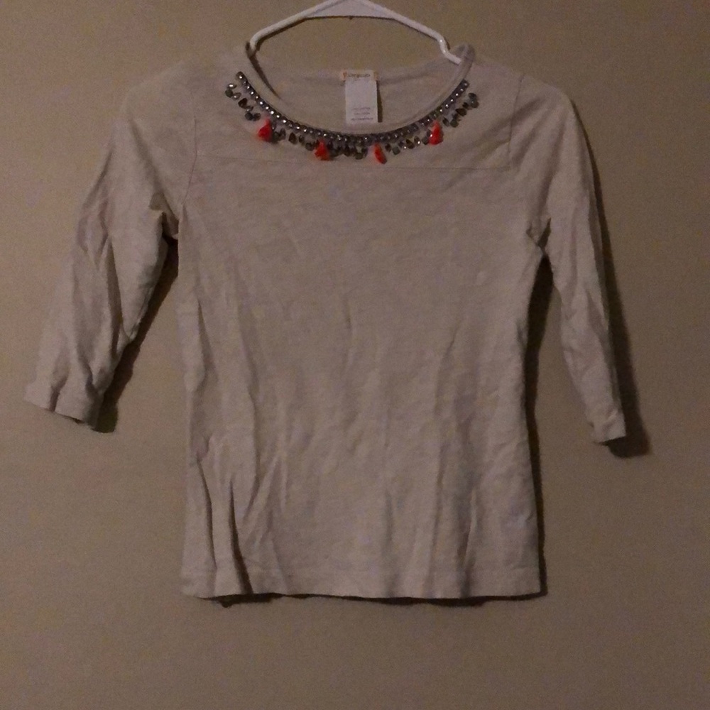 Long sleeved shirt with jems around top